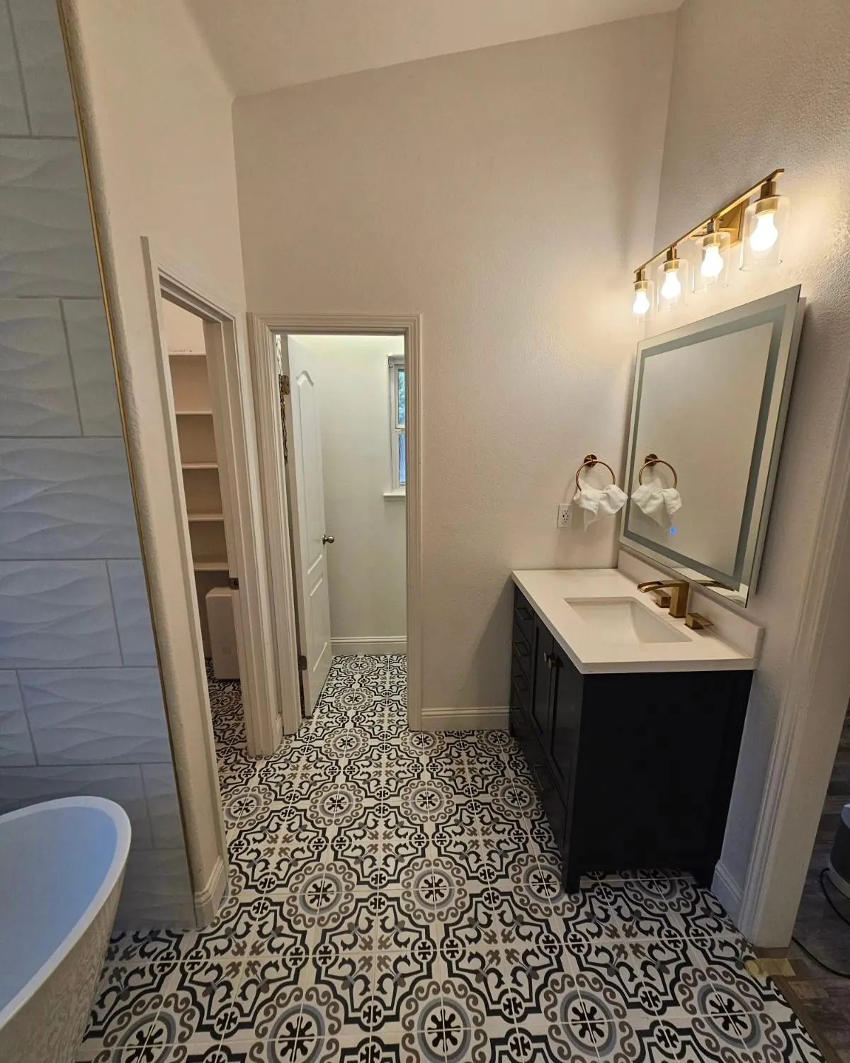 Custom master bathroom remodel with freestanding tub and patterned tile